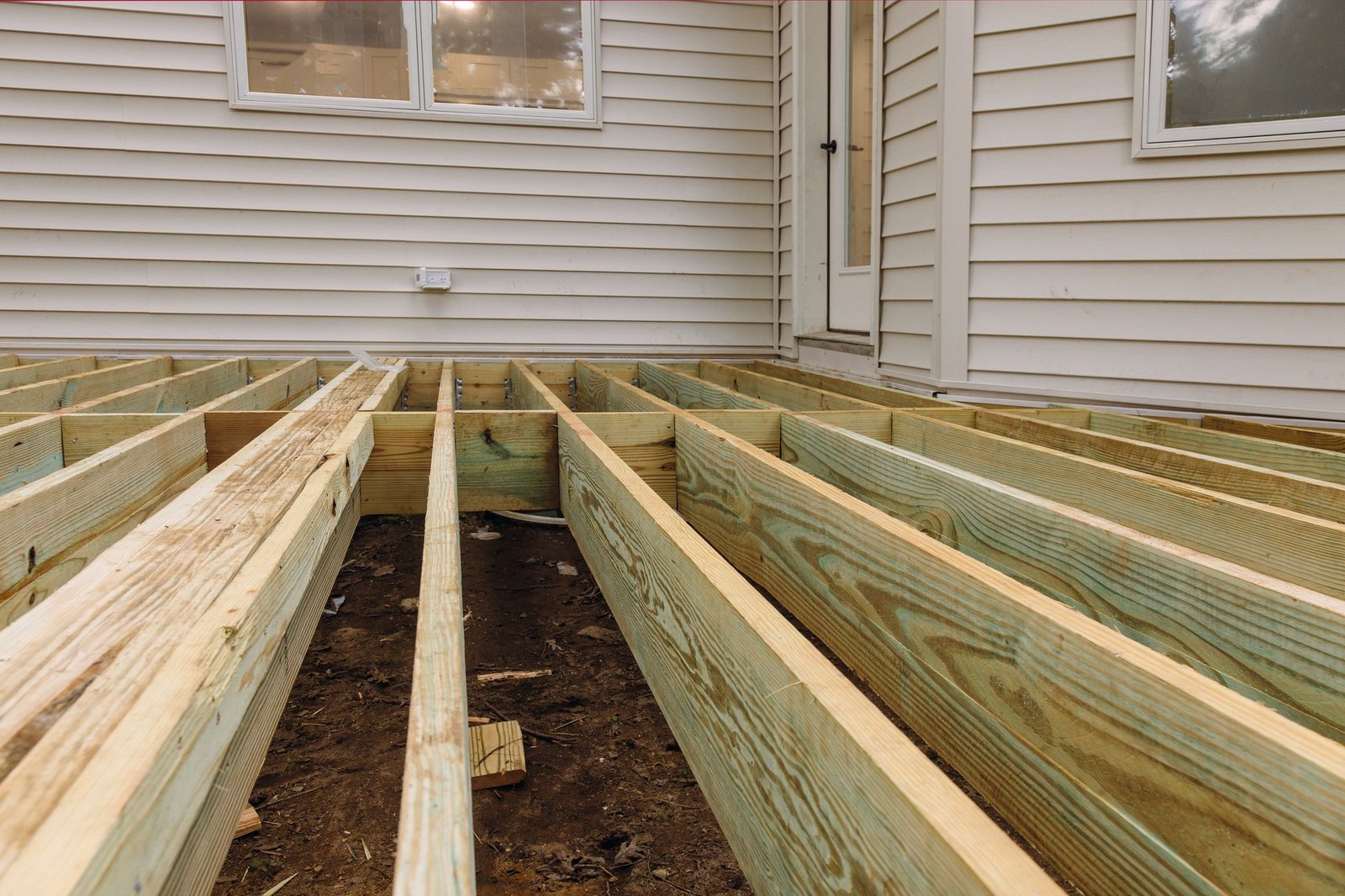 Installing deck patio construction. boards with above ground deck